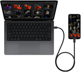 iPhone 15 Pro Max liitettynä 14 tuuman MacBook Prohon USB-C-johdolla